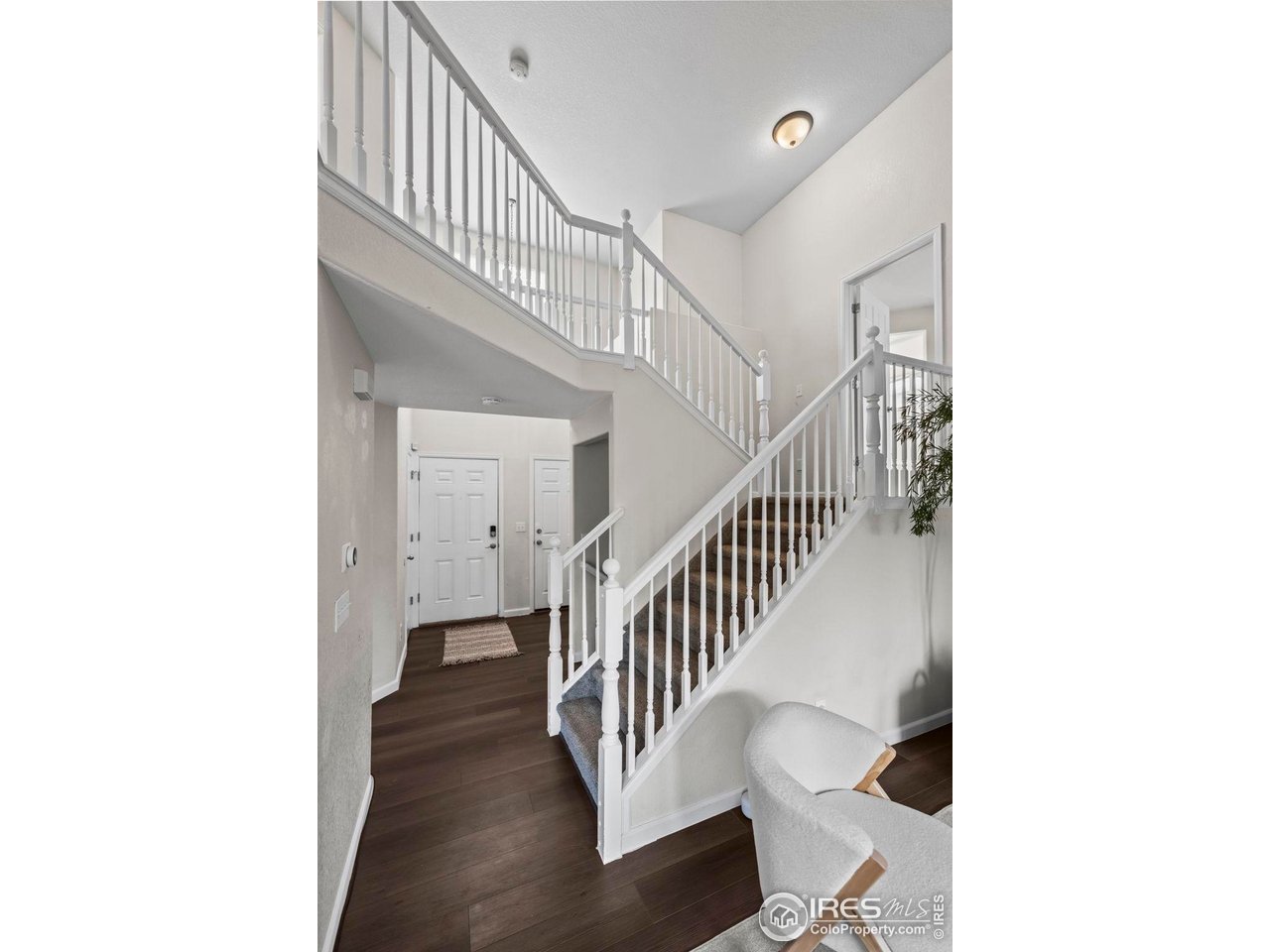 2529 Azalea Way Erie, CO 80516 - Photo 3 of 32 a view of a hallway with staircase