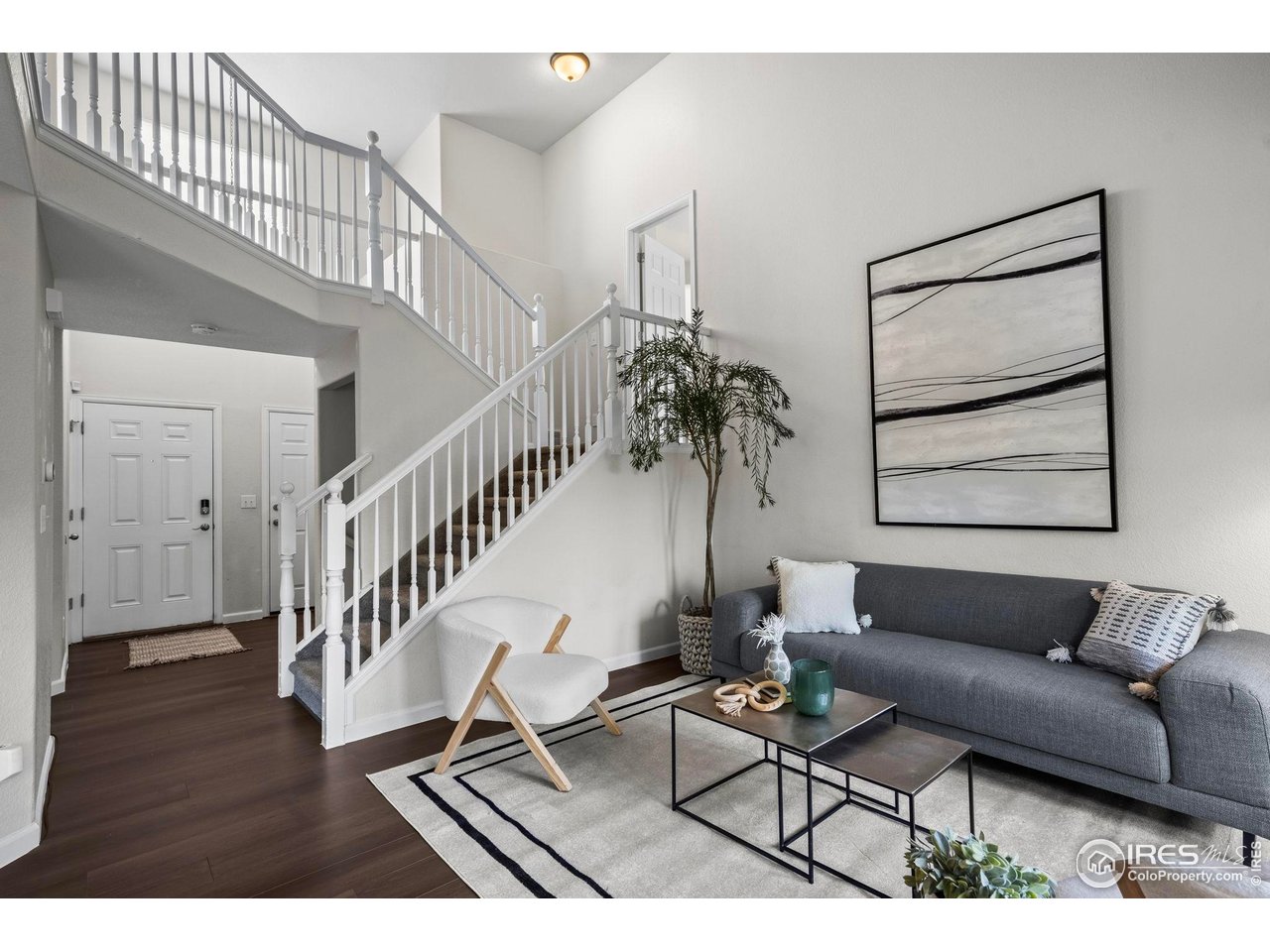 2529 Azalea Way Erie, CO 80516 - Photo 4 of 32 a living room with furniture and wooden floor