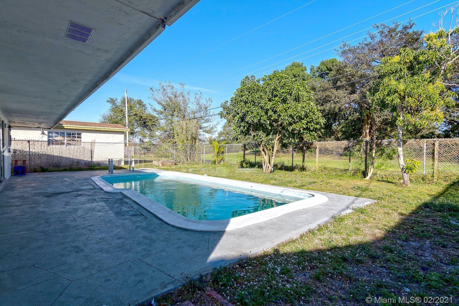 3829 East Shore Road Miramar, FL 33023 - Photo 11 of 14 a view of yard with swimming pool and sitting area