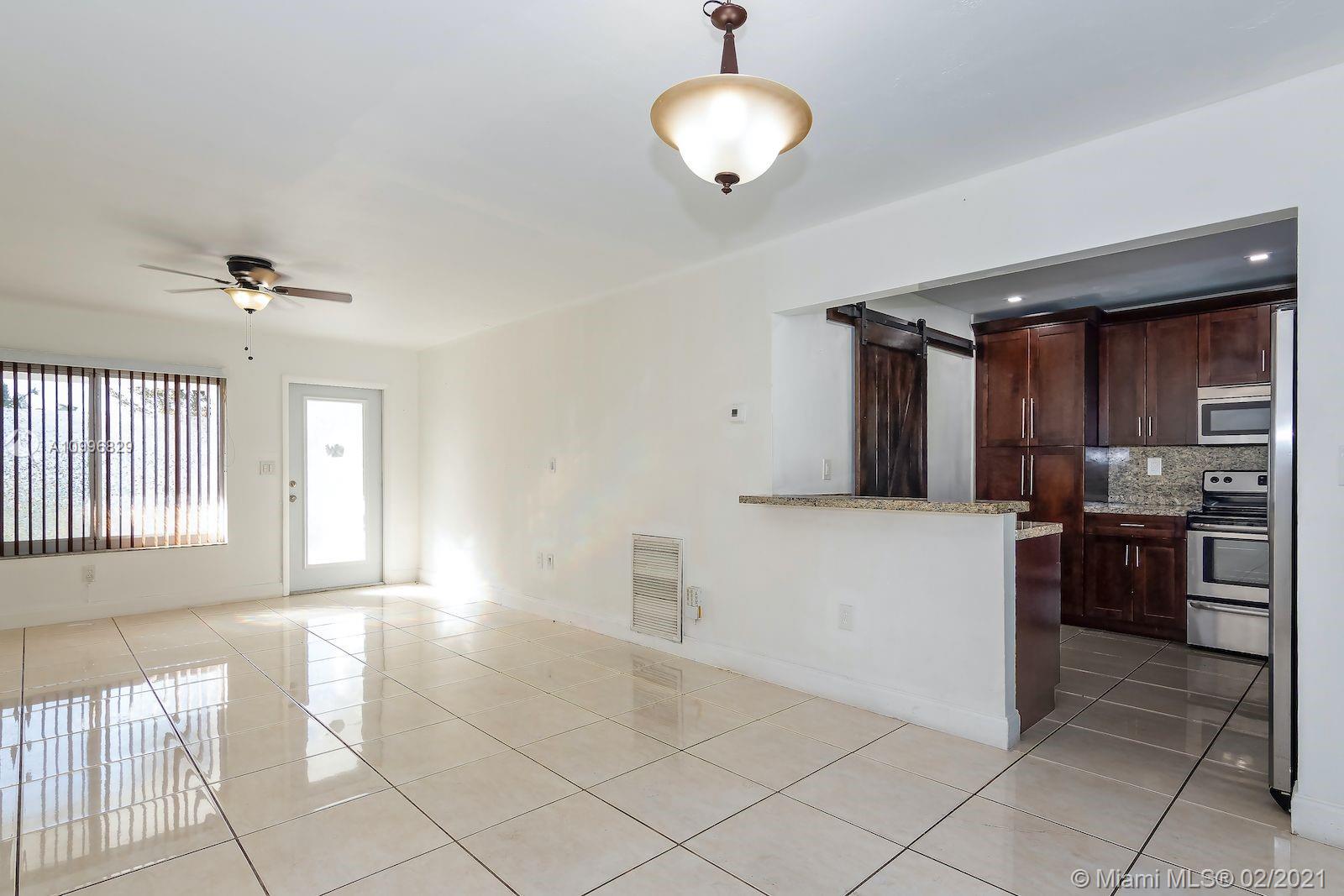 3829 East Shore Road Miramar, FL 33023 - Photo 3 of 14 a view of a electric appliances and cabinets in a room