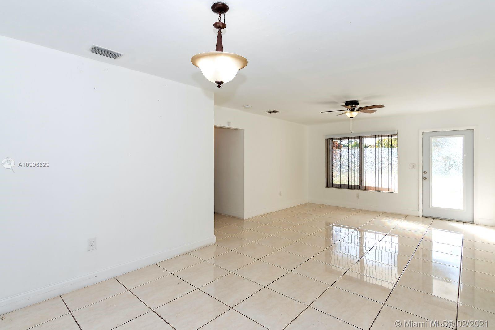 3829 East Shore Road Miramar, FL 33023 - Photo 4 of 14 a view of an empty room and window