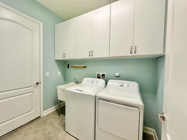a utility room with dryer and washer