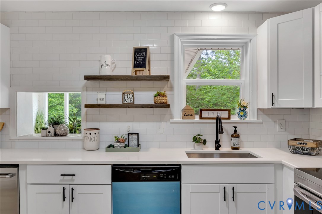 7709 Yolanda Road Henrico, VA 23229 - Photo 13 of 26 Kitchen with dishwasher, backsplash, white cabinet