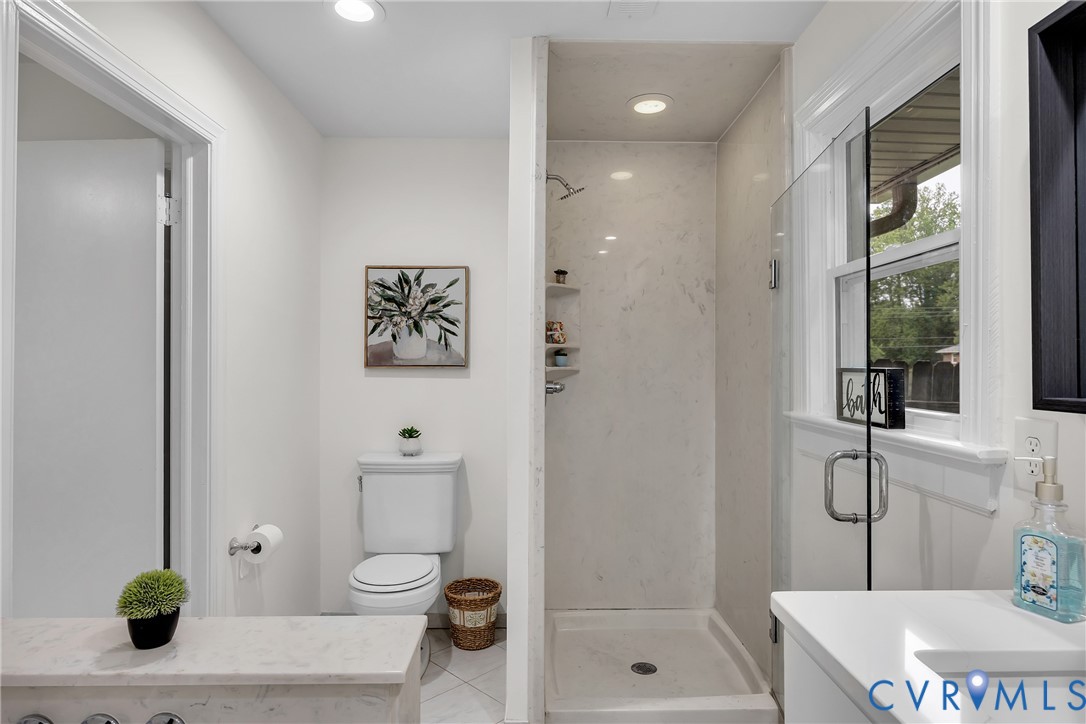 7709 Yolanda Road Henrico, VA 23229 - Photo 23 of 26 Full bathroom with a stall shower, tile patterned