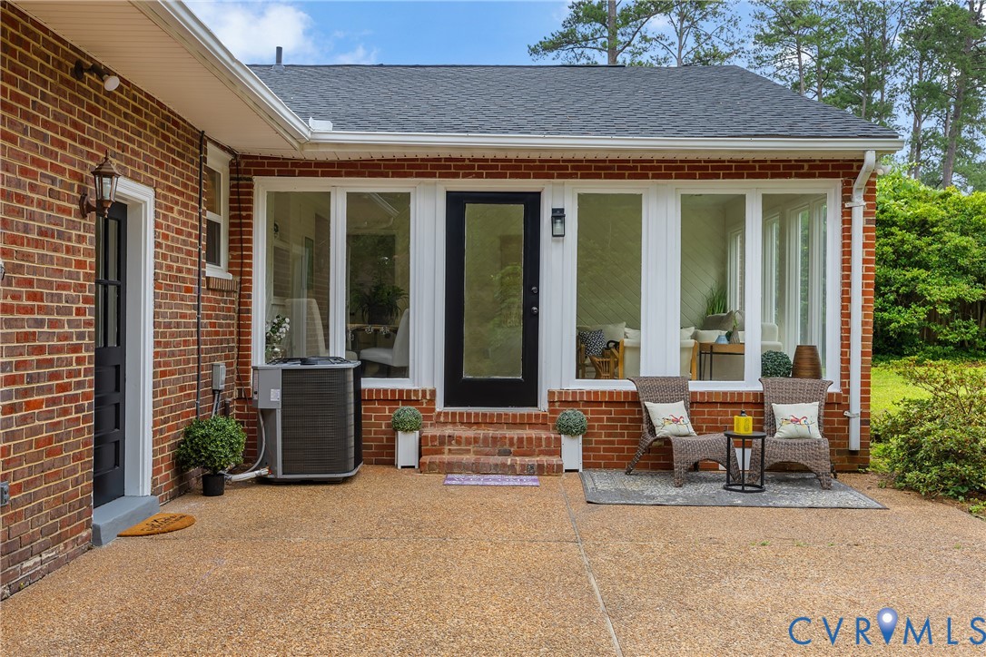 7709 Yolanda Road Henrico, VA 23229 - Photo 25 of 26 View of exterior entry with roof with shingles and