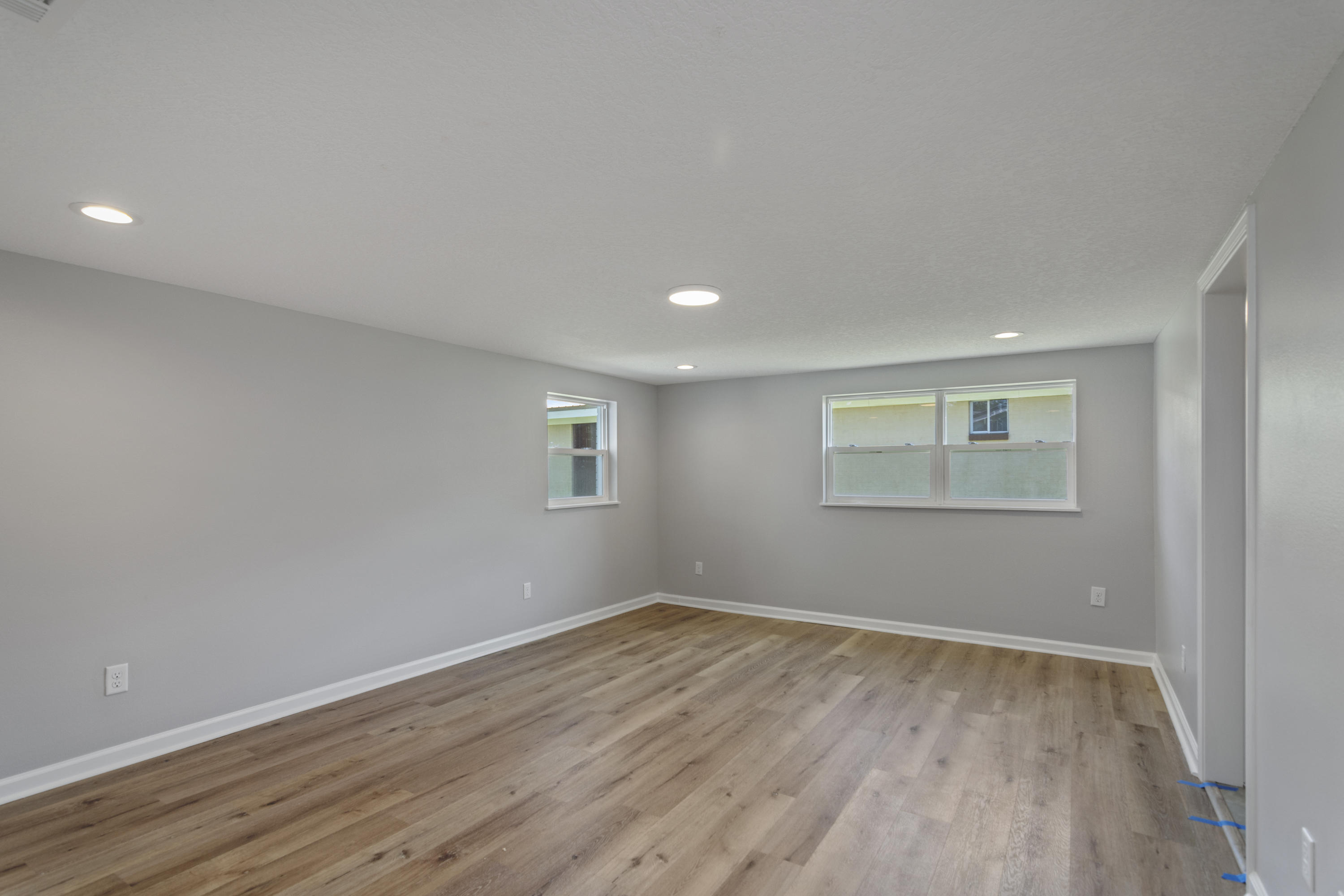 3032 Adams Road Crestview, FL 32536 - Photo 14 of 41 a view of empty room with wooden floor