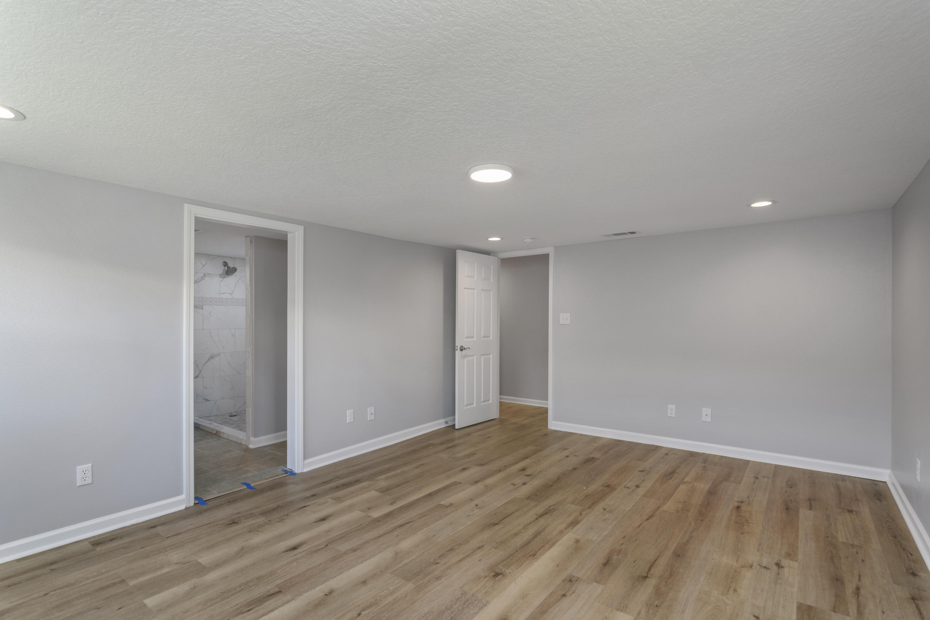 3032 Adams Road Crestview, FL 32536 - Photo 15 of 41 a view of an empty room with wooden floor and closet