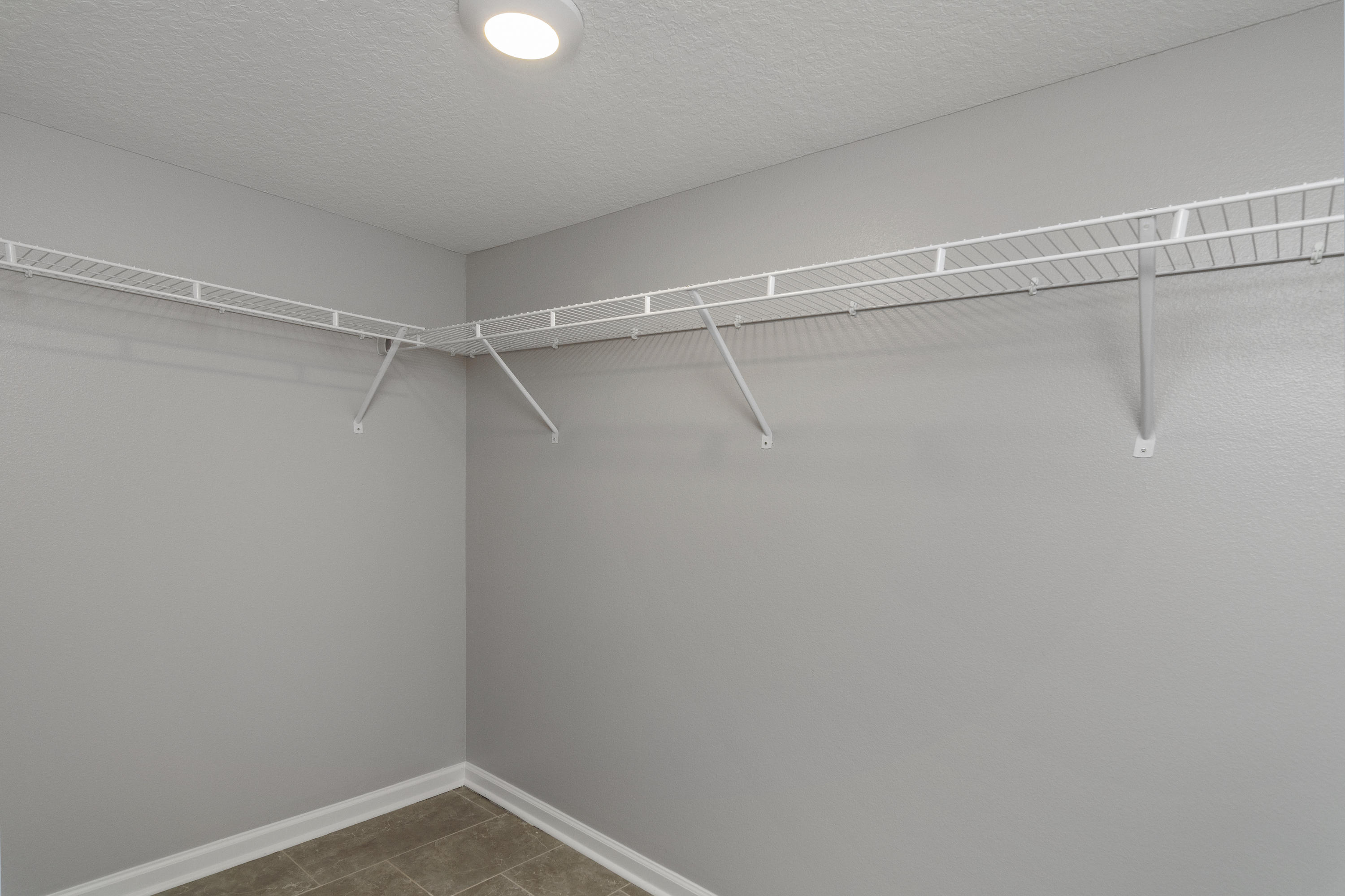 3032 Adams Road Crestview, FL 32536 - Photo 20 of 41 a view of a room with racks on the wall