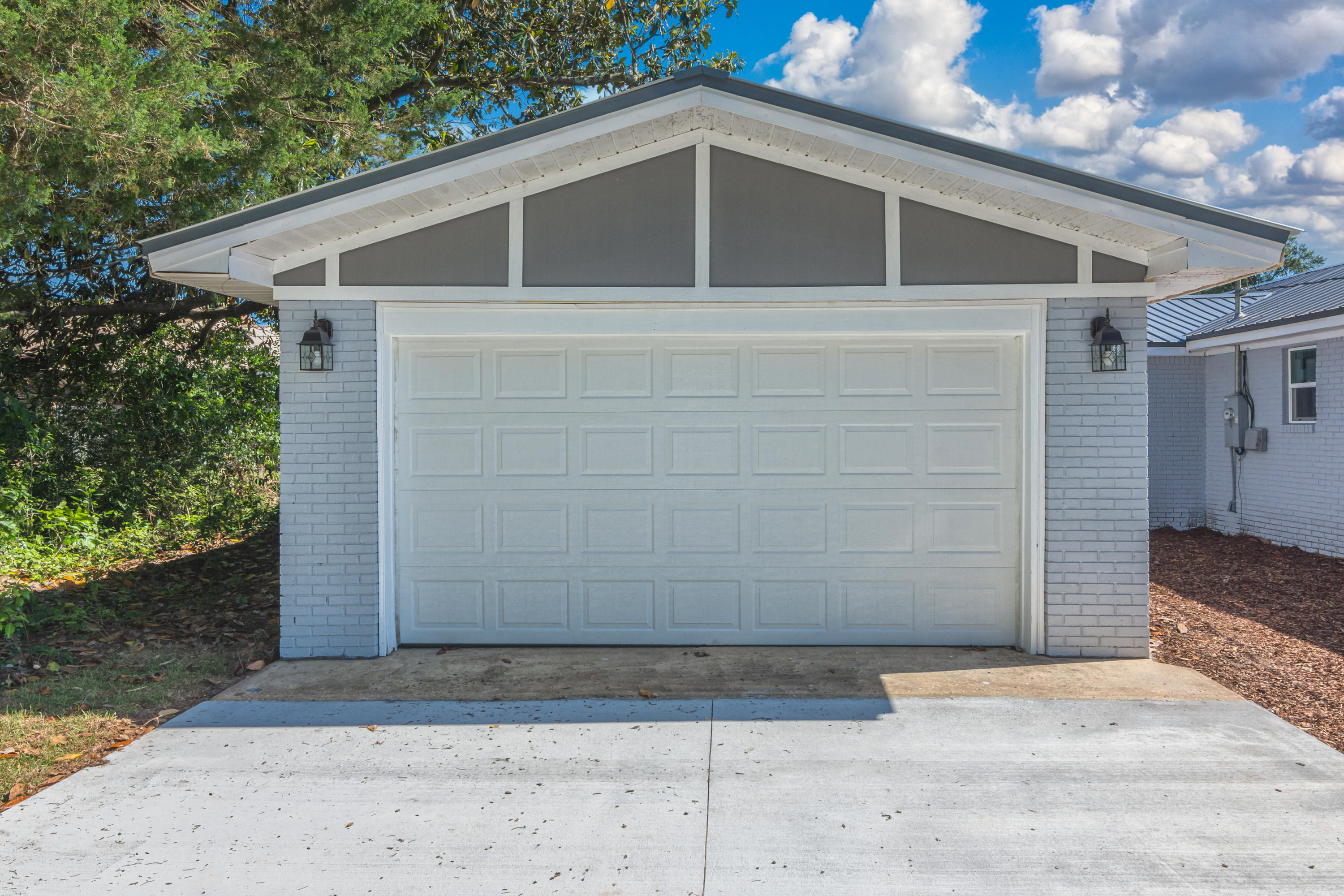 3032 Adams Road Crestview, FL 32536 - Photo 4 of 41 a front view of a house with a garage