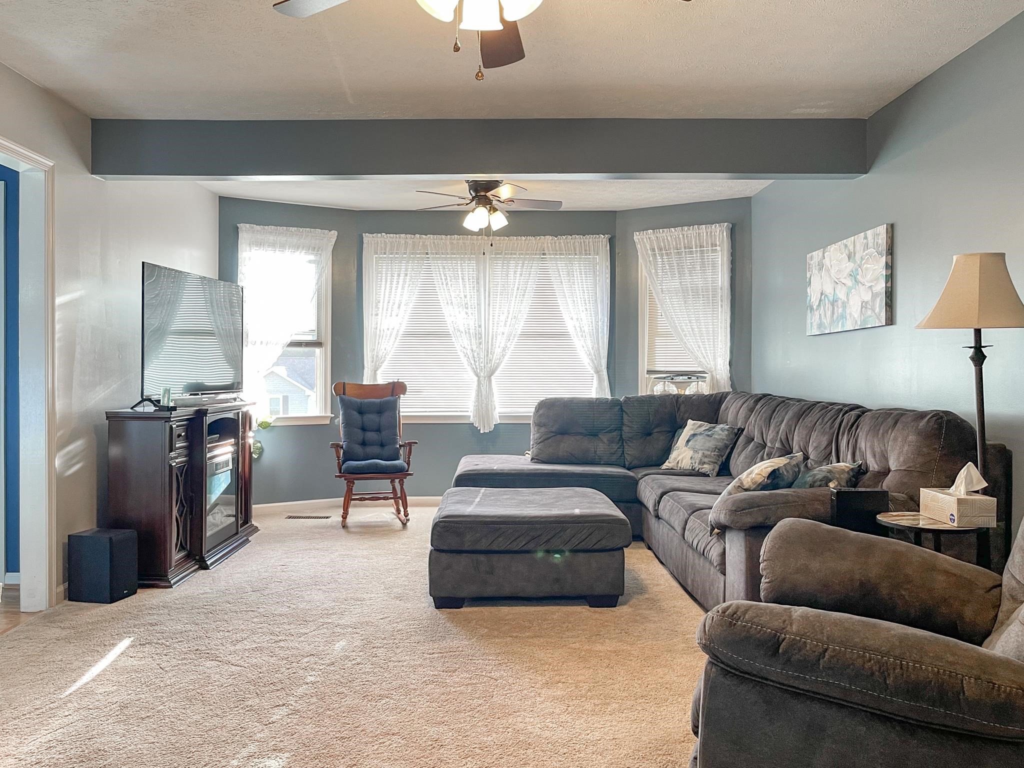 172 Beagle Gap Run Waynesboro, VA 22980 - Photo 19 of 32 a living room with furniture and a chandelier