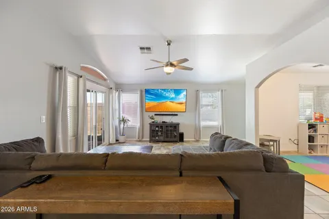 a living room with furniture and a large window