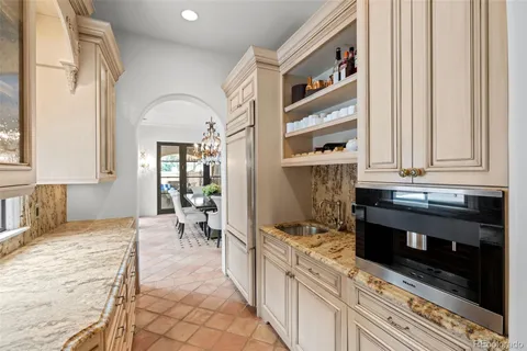 a kitchen with stainless steel appliances granite countertop a stove and a sink