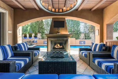 a living room with furniture a rug and a fireplace