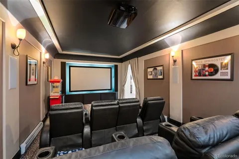 a view of a livingroom with workspace and a window