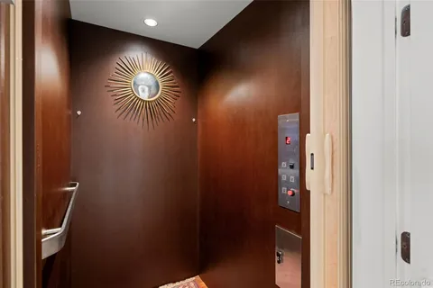 a bathroom with a sink and glass door