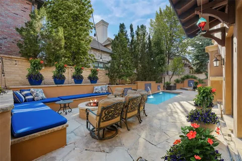 a living room with furniture a fireplace and a table