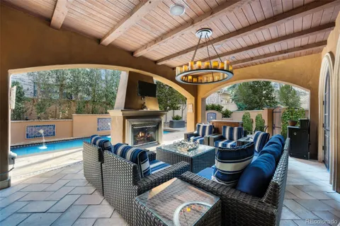 a view of a backyard with sitting area