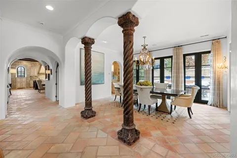 a view of a livingroom with furniture and a floor to ceiling window