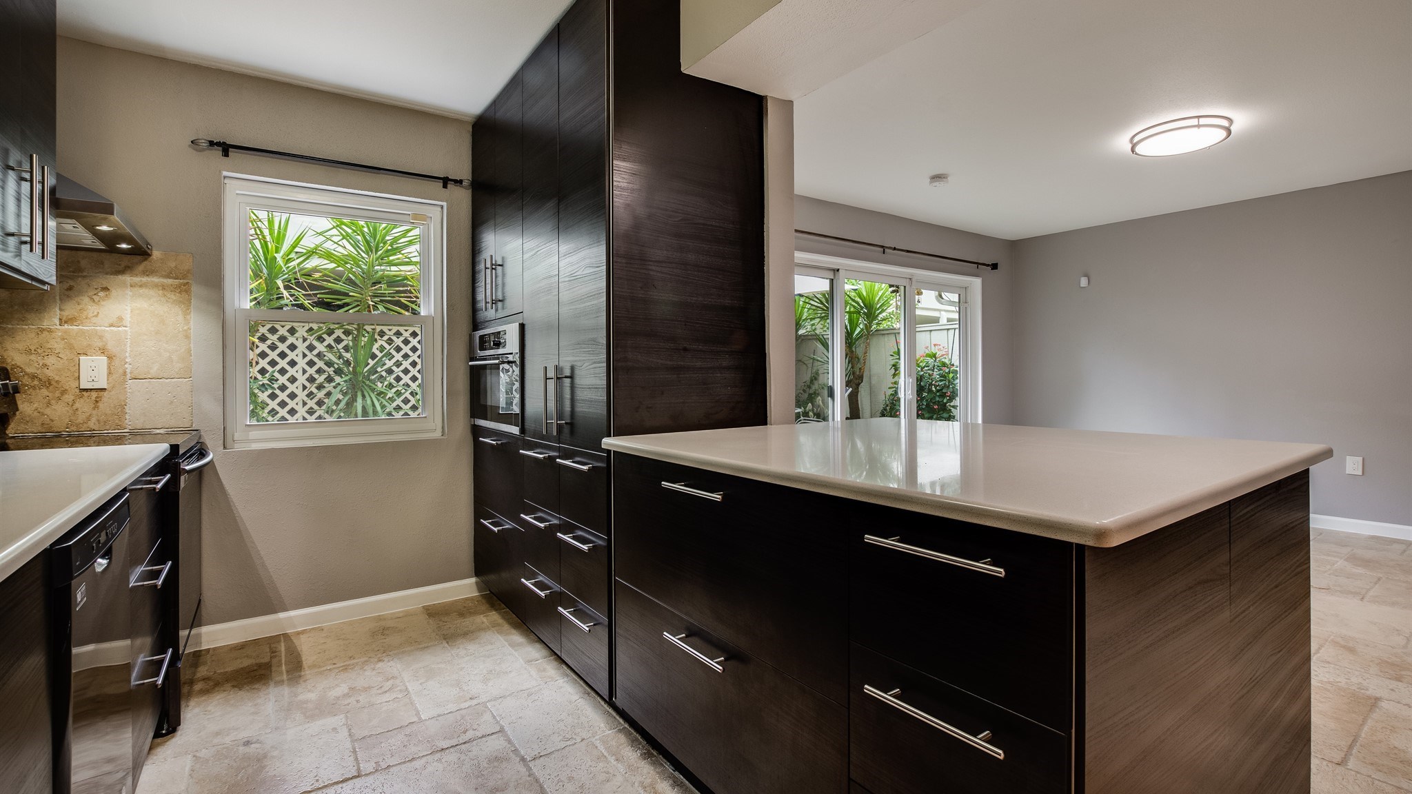 12615 Huntingwick Drive Houston, TX 77024 - Photo 13 of 35 a kitchen with a sink and a refrigerator