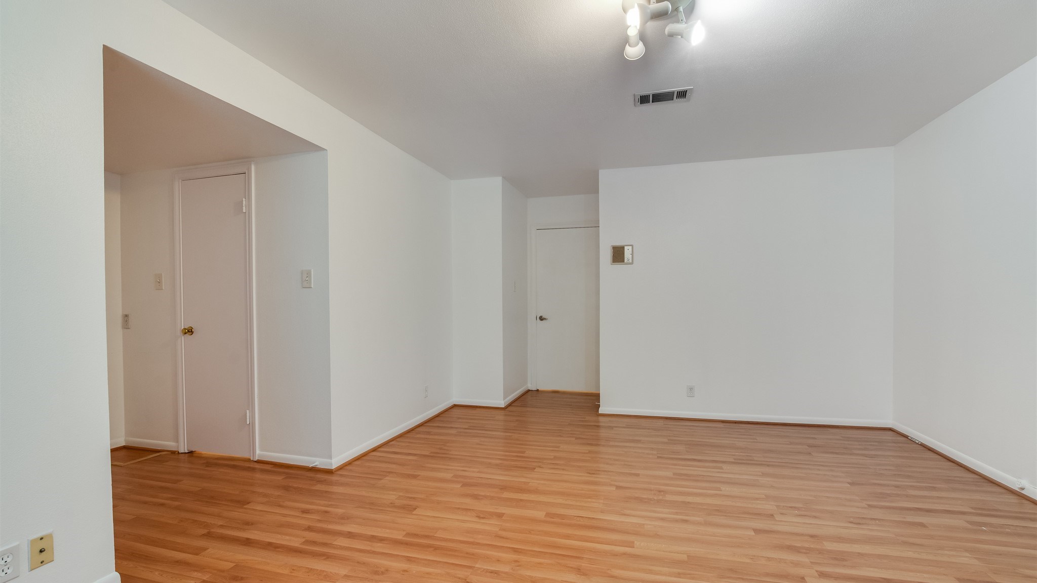12615 Huntingwick Drive Houston, TX 77024 - Photo 24 of 35 a view of empty room with wooden floor