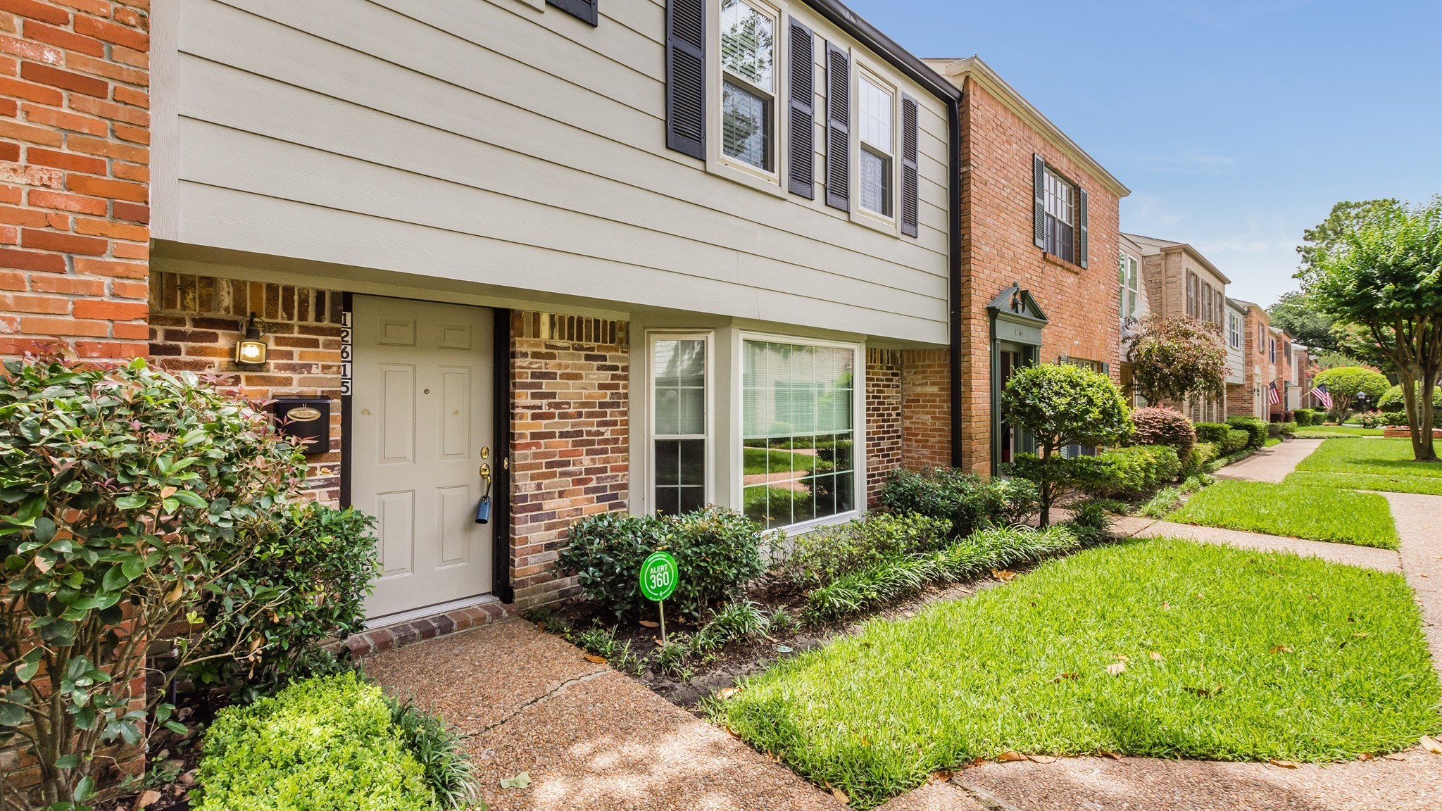 12615 Huntingwick Drive Houston, TX 77024 - Photo 3 of 35 a front view of a house with garden