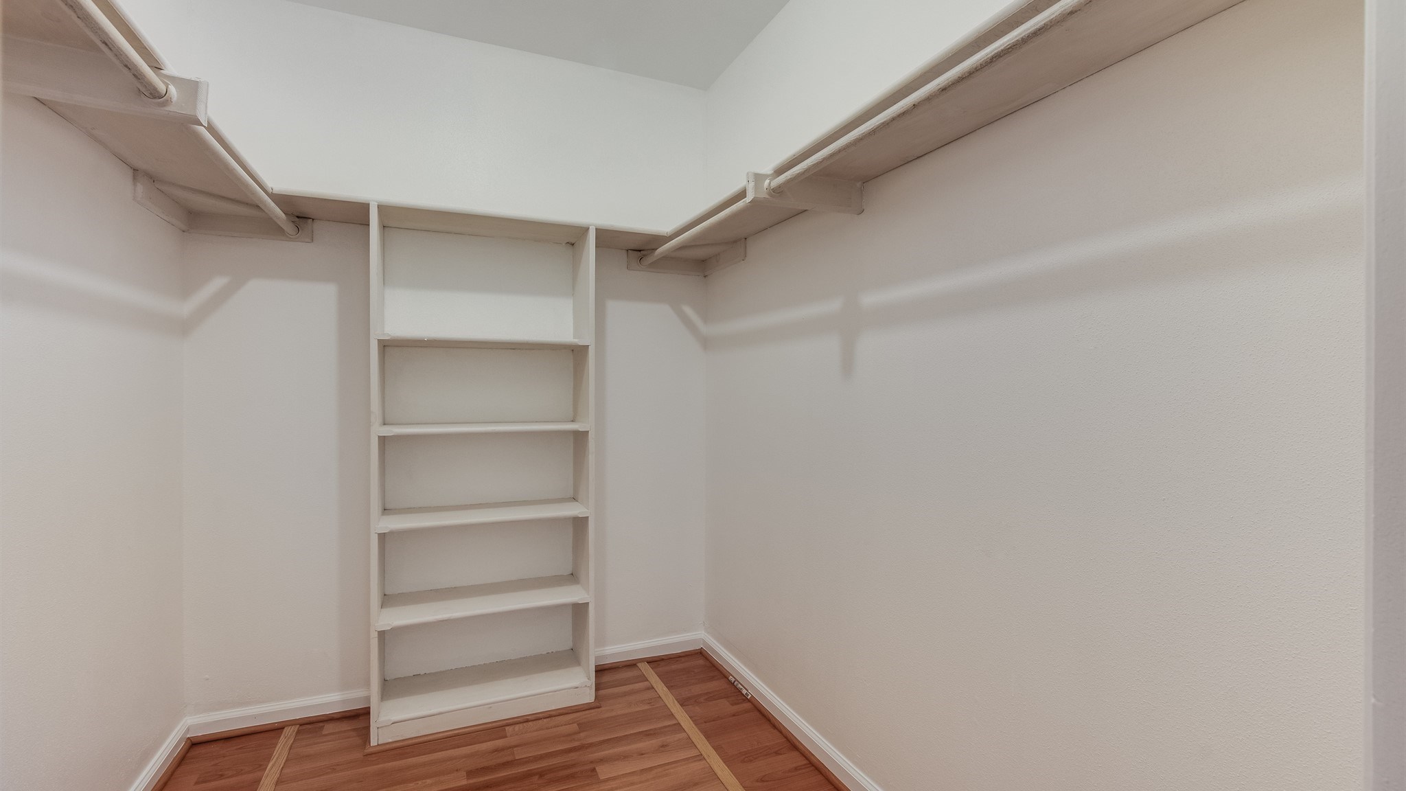 12615 Huntingwick Drive Houston, TX 77024 - Photo 31 of 35 a view of walk in closet with empty racks