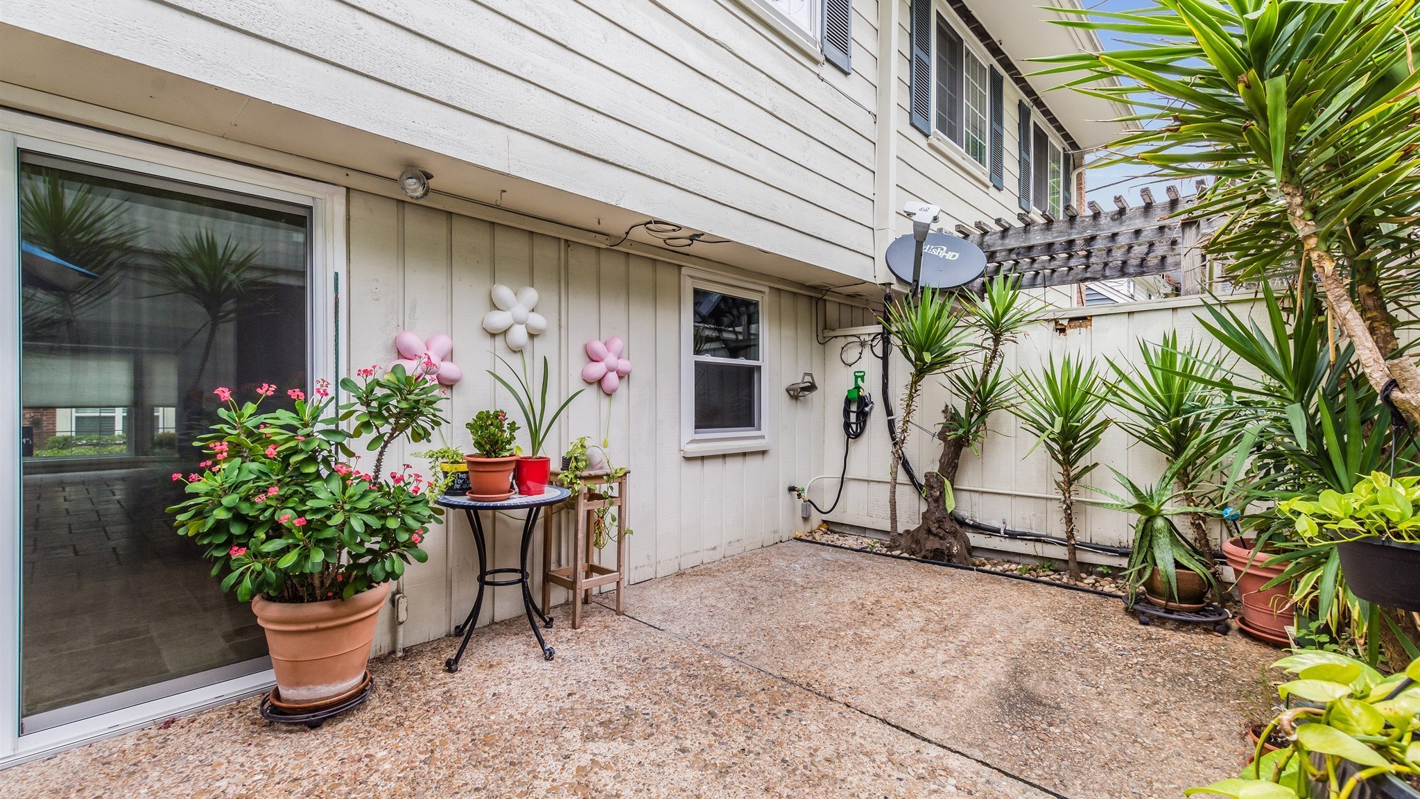12615 Huntingwick Drive Houston, TX 77024 - Photo 32 of 35 a view of a porch with potted plants