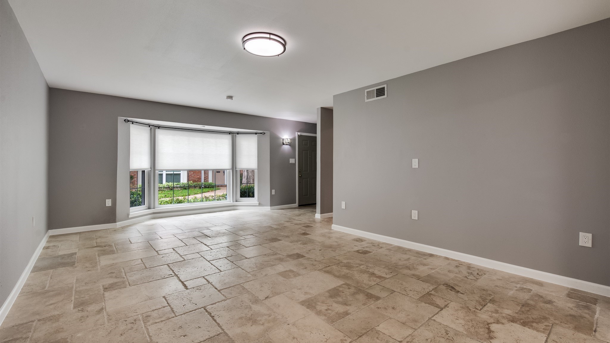 12615 Huntingwick Drive Houston, TX 77024 - Photo 5 of 35 a view of an empty room with a window