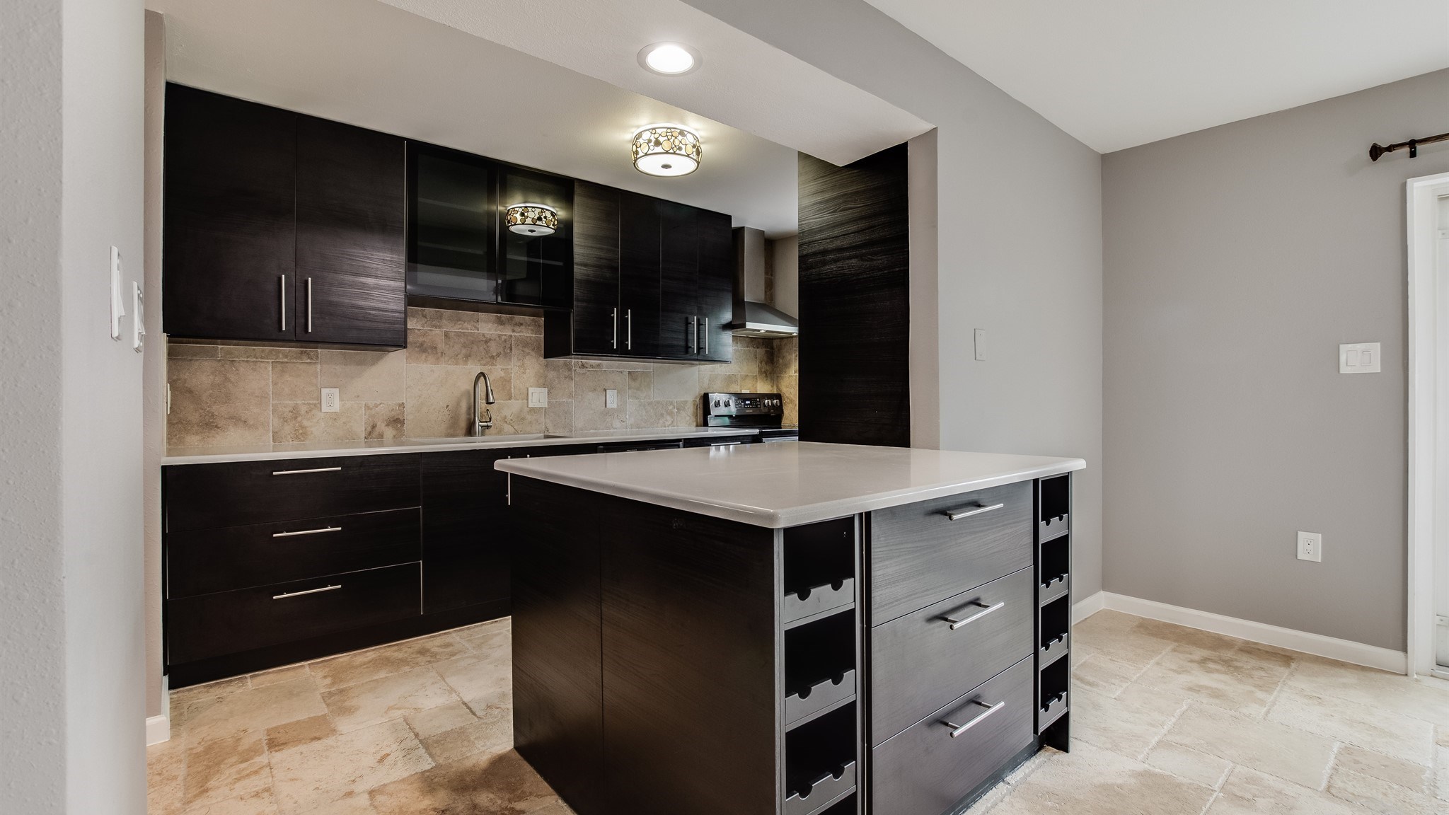 12615 Huntingwick Drive Houston, TX 77024 - Photo 10 of 35 a kitchen with a sink and cabinets