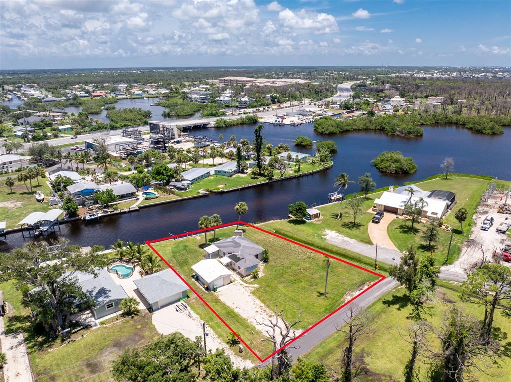 1899 Riverside Drive Englewood, FL 34223 - Photo 3 of 20 an aerial view of a city with a lake