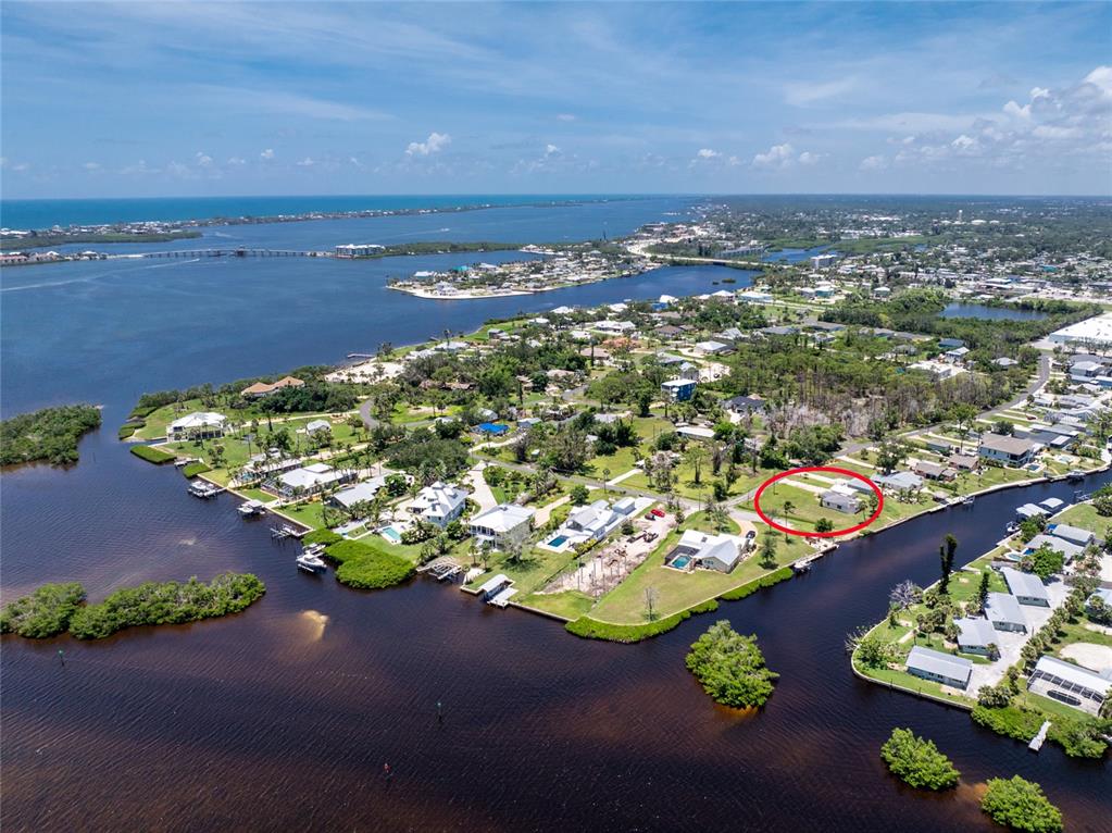 1899 Riverside Drive Englewood, FL 34223 - Photo 9 of 20 an aerial view of a house with a yard and lake view