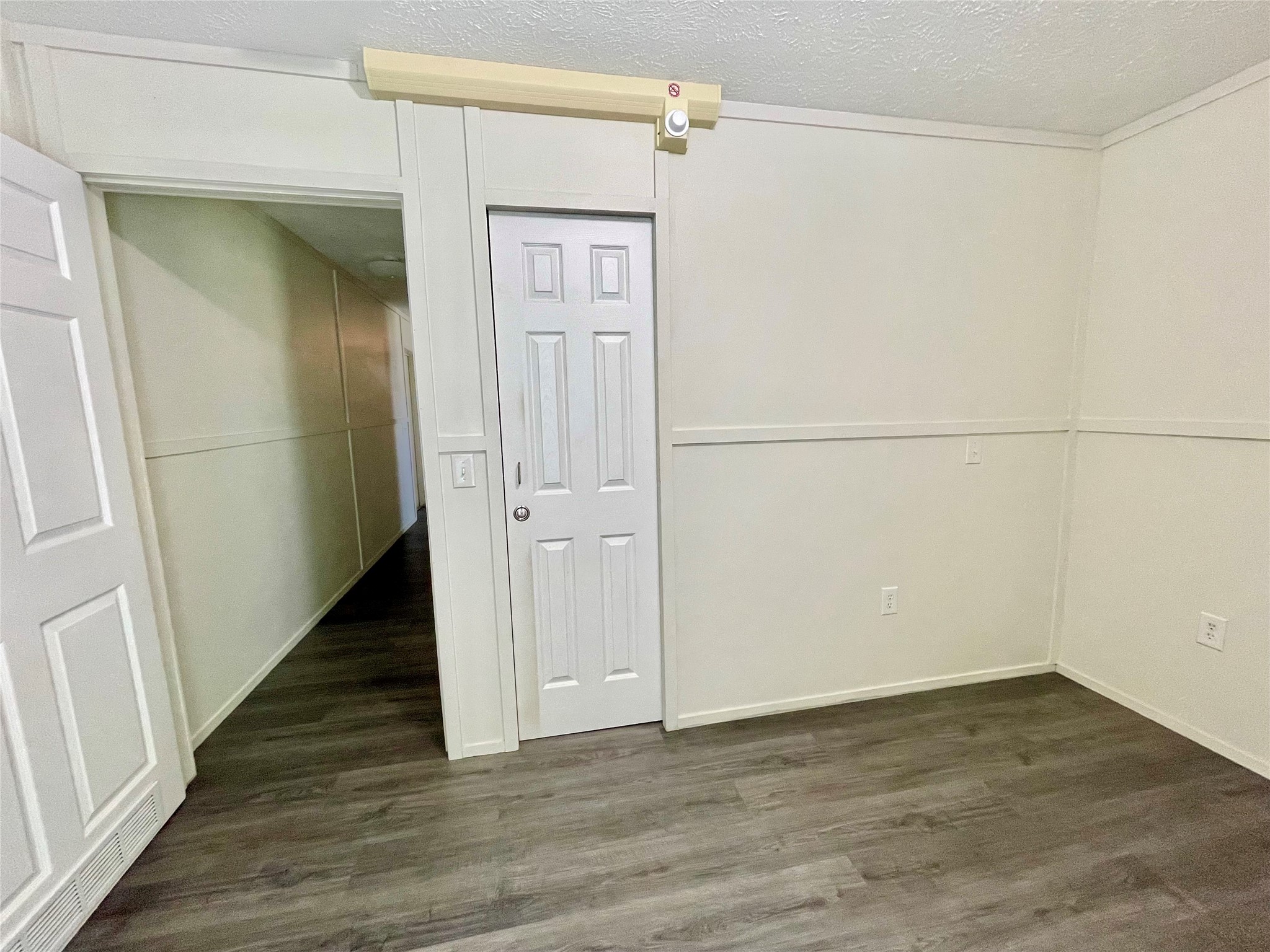 71 Woodrow Street Coldspring, TX 77331 - Photo 1 of 23 a view of a hallway with wooden floor and staircase