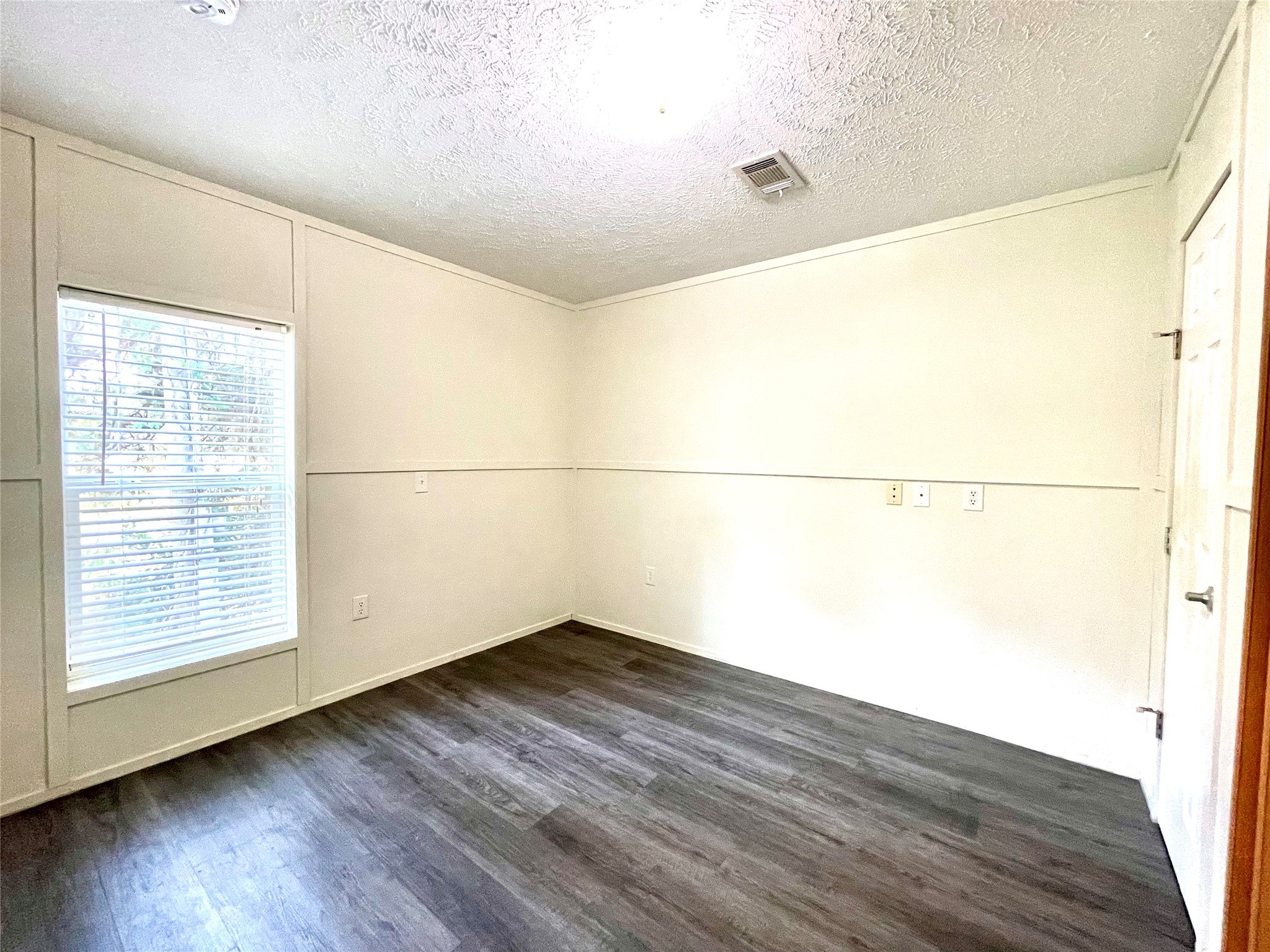 71 Woodrow Street Coldspring, TX 77331 - Photo 16 of 23 a view of a big room with wooden floor