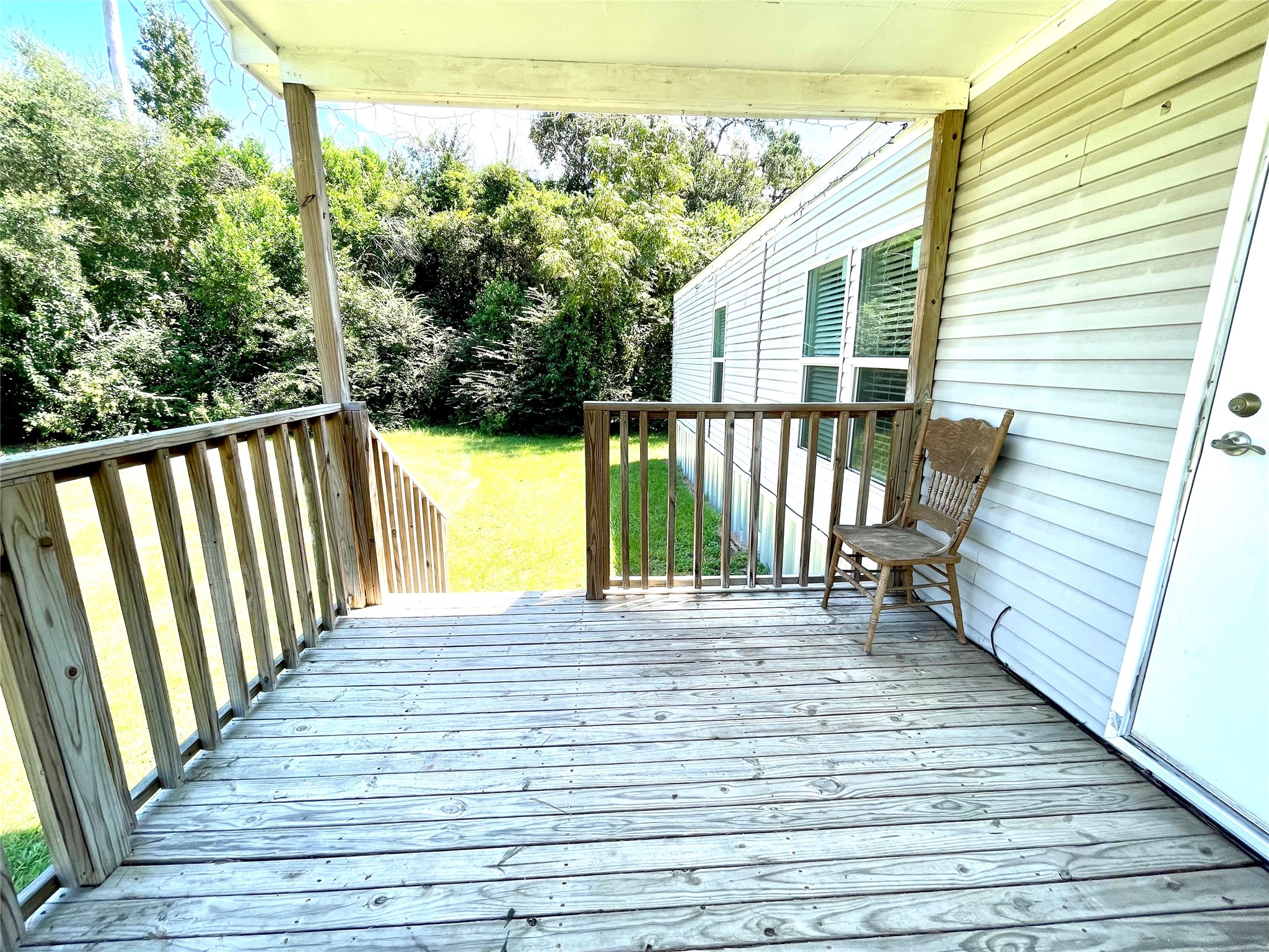 71 Woodrow Street Coldspring, TX 77331 - Photo 21 of 23 a view of a balcony with wooden floor