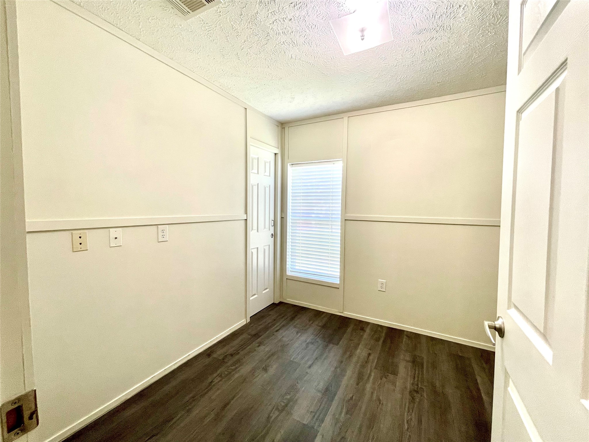 71 Woodrow Street Coldspring, TX 77331 - Photo 3 of 23 a view of a small space with wooden floor