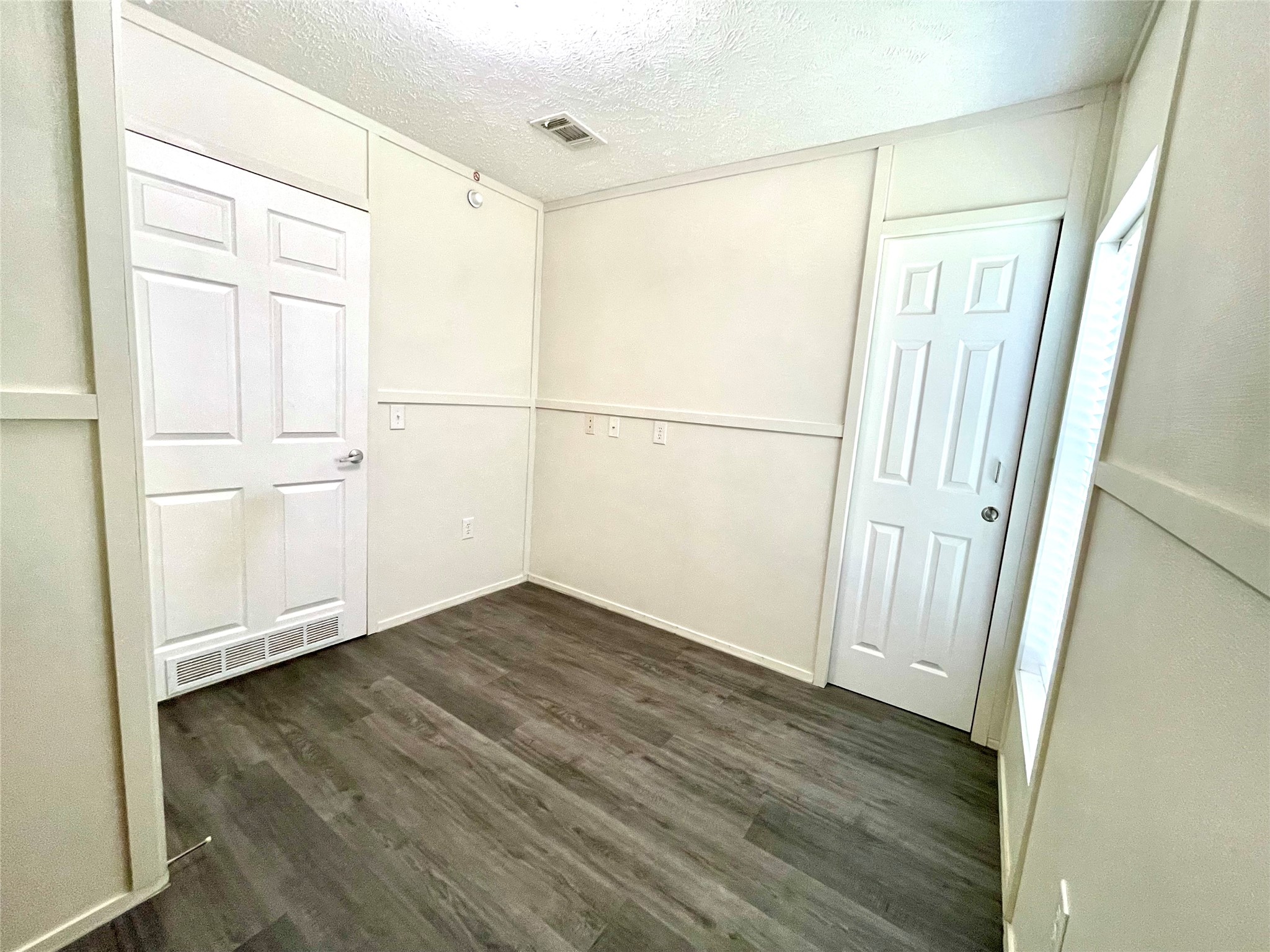 71 Woodrow Street Coldspring, TX 77331 - Photo 4 of 23 a view of a small space with wooden floor
