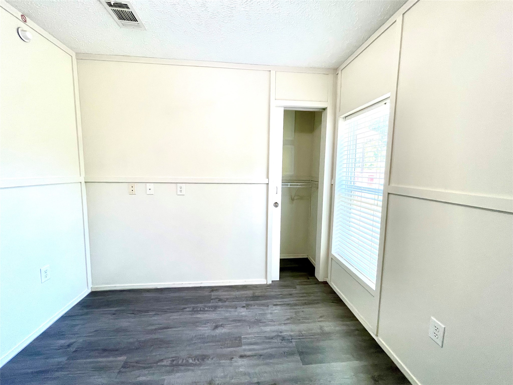 71 Woodrow Street Coldspring, TX 77331 - Photo 5 of 23 a view of a room with wooden floor