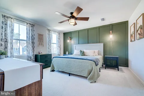 a bedroom with a bed and window