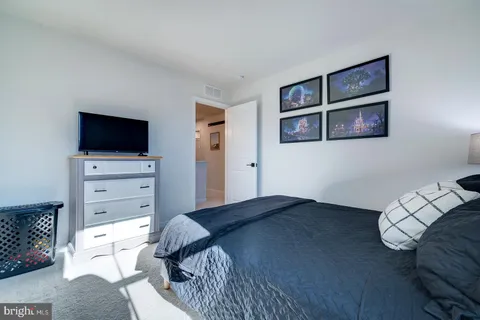 a bedroom with a bed and furniture