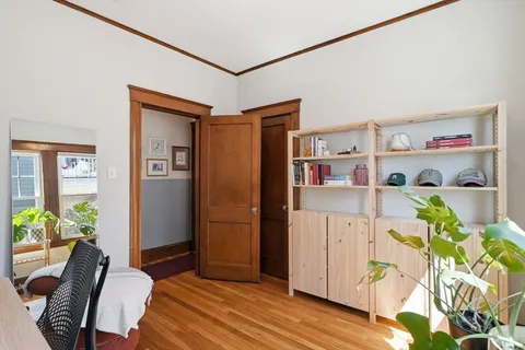 a bedroom with furniture and a closet