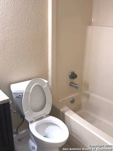a view of a room with a hanging chair