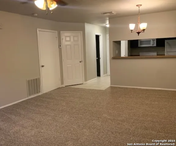 a close view of sink and cabinets