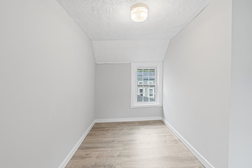 95 South Main Street, Unit B Andover, MA 01810 - Photo 27 of 34 an empty room with windows