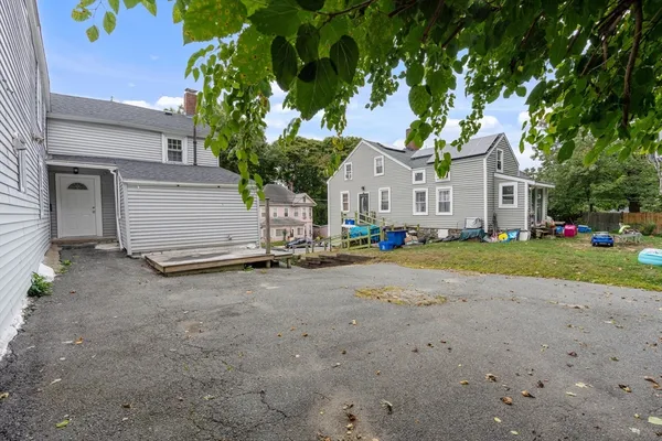 a view of a house with a backyard