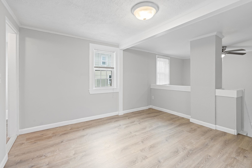 95 South Main Street, Unit B Andover, MA 01810 - Photo 7 of 34 an empty room with windows