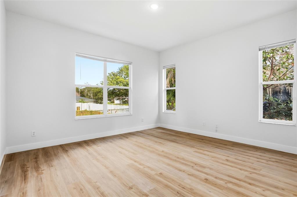 3345 Furlong Way Gotha, FL 34734 - Photo 15 of 34 an empty room with wooden floor and windows
