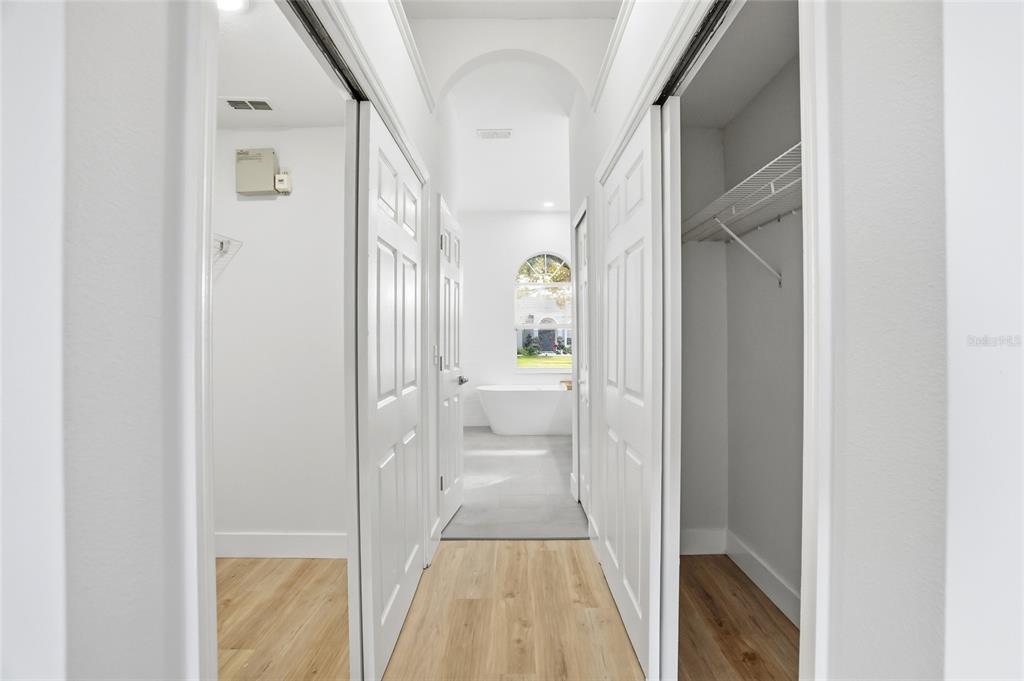 3345 Furlong Way Gotha, FL 34734 - Photo 16 of 34 a view of a hallway with a livingroom and a bathroom with a bathtub