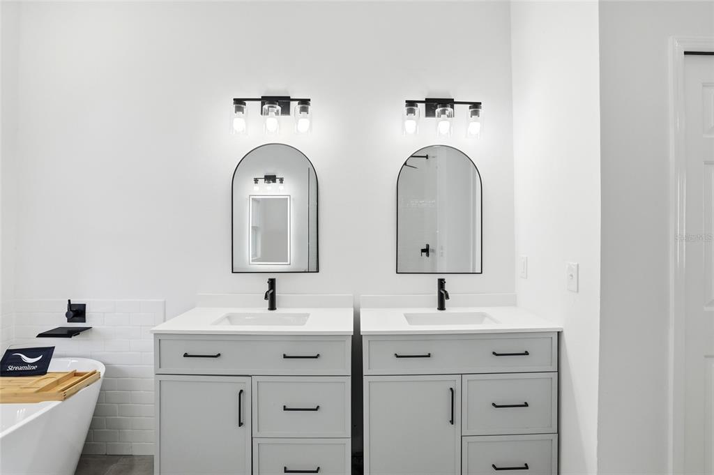 3345 Furlong Way Gotha, FL 34734 - Photo 17 of 34 a bathroom with double sink and a mirror