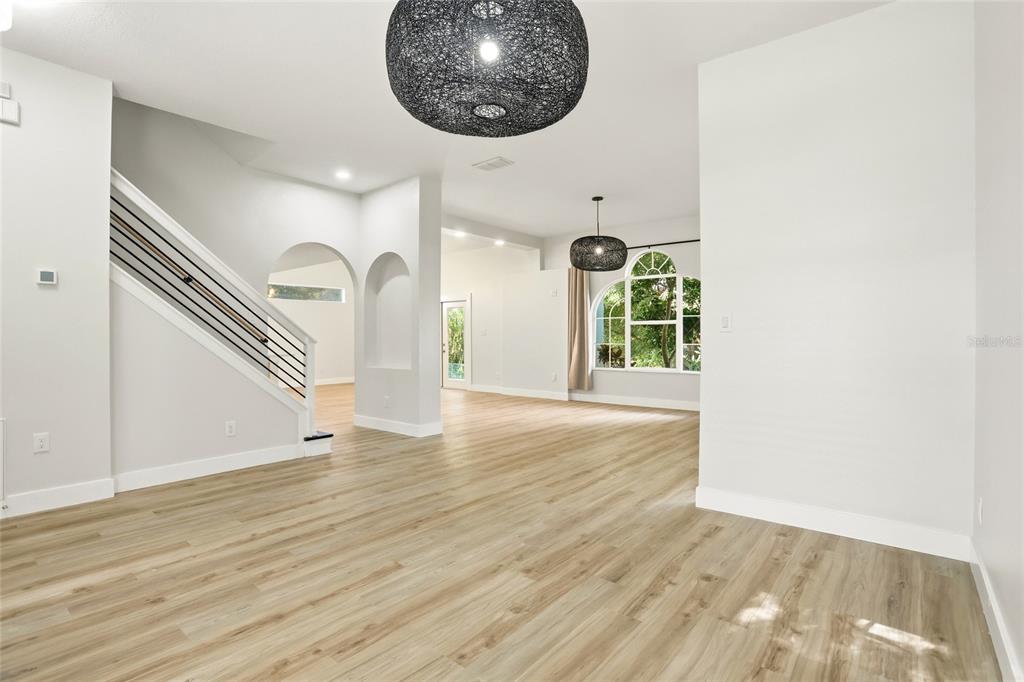 3345 Furlong Way Gotha, FL 34734 - Photo 21 of 34 a view of an empty room with wooden floor and a window