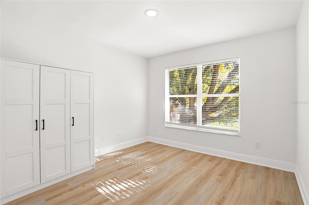 3345 Furlong Way Gotha, FL 34734 - Photo 27 of 34 an empty room with wooden floor and windows